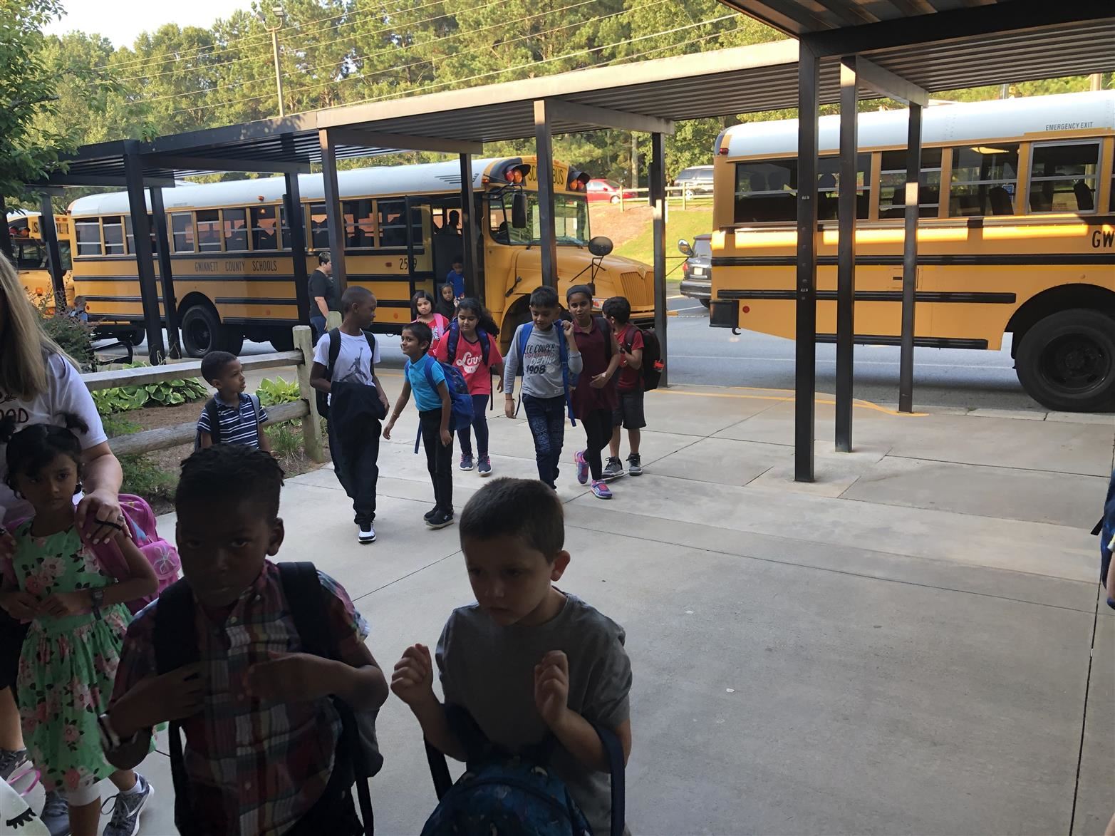 students arriving off the bus