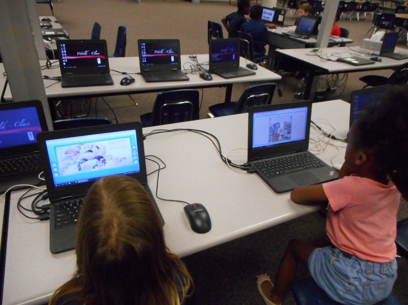 Students researching on a laptop