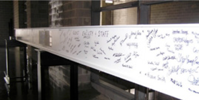 Beam signed by students, staff, and advisory board members as part of the school’s topping off ceremony.