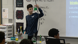 Student in front of classroom