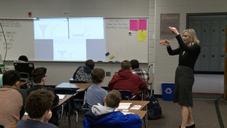 Teacher teaching students in classroom