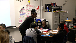  Teacher discusses with small group