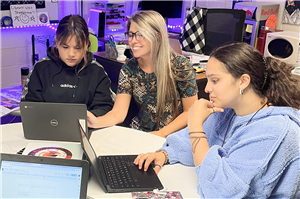 Collins Hill High School teacher with students