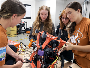 Lanier SeaCows working on their robot
