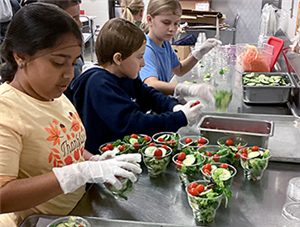 White Oaks students preparing salads for lunch