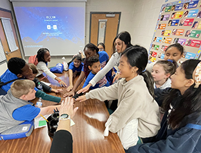 Parson ES students with their hands in