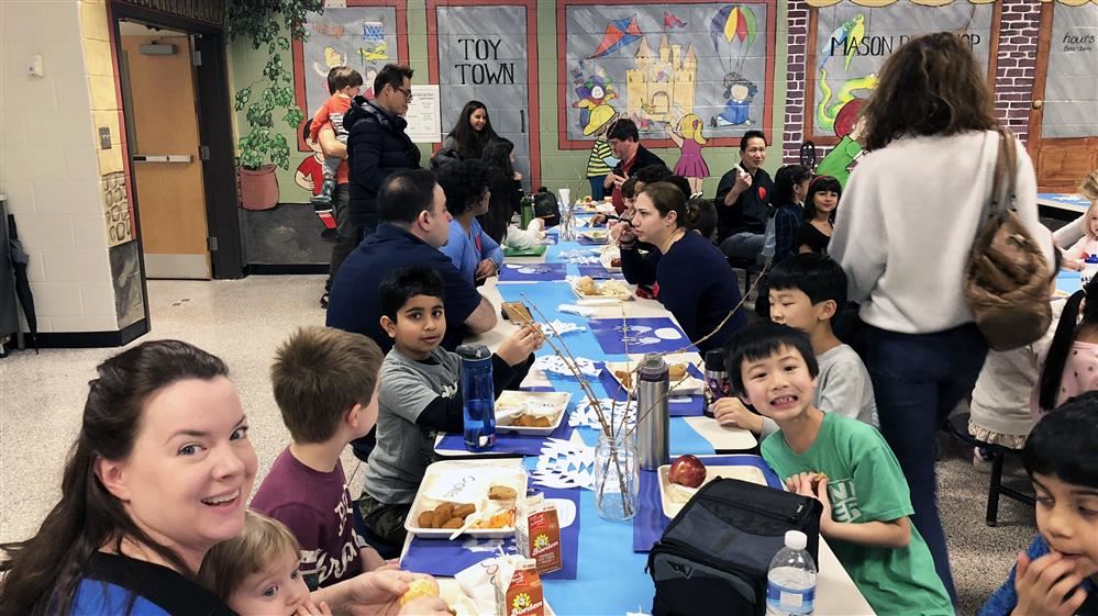 Students and parents enjoy lunch at the winter luncheon.