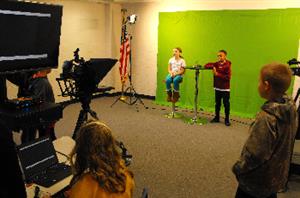 Students working in the news studio B 