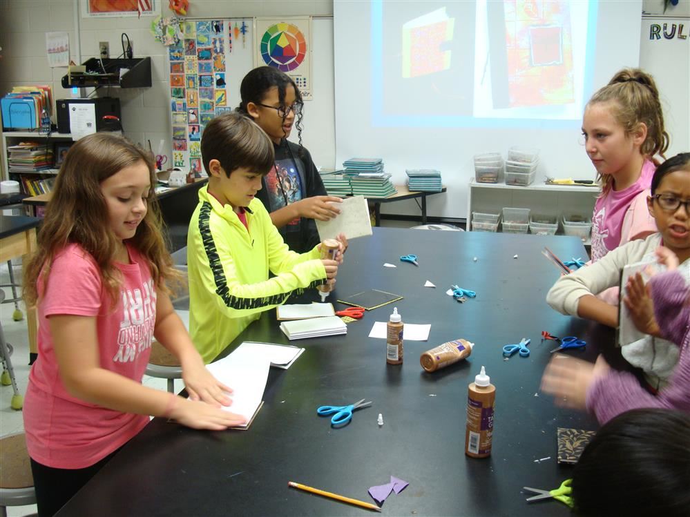 Art Club students working on homemade books.