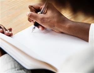 Writing in Notebook 