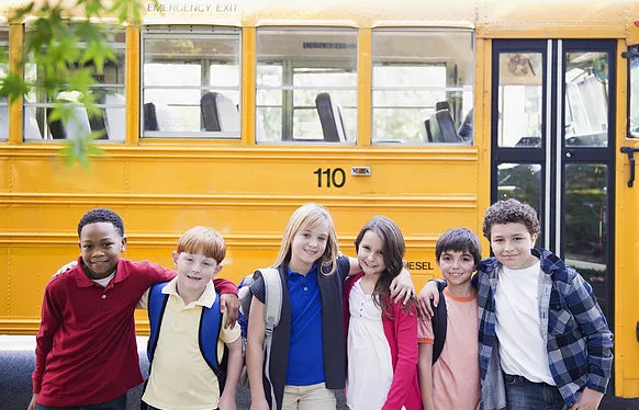 Students in front of bus 