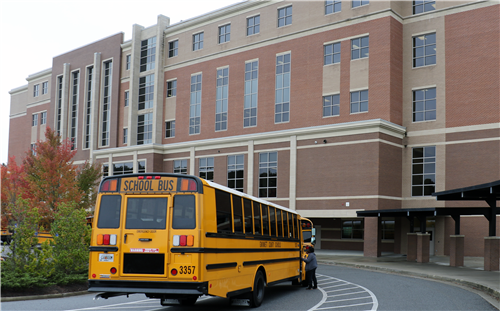 Bus behind main tower 