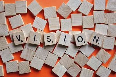 Vision spelled with Scrabble tiles 