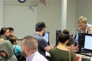 Ms. Hill assists with Orientation 