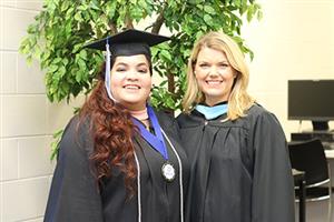 Ms. Cunningham with a G.O.C. Graduate. 