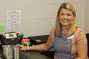Ms. Cunningham working at her desk. 