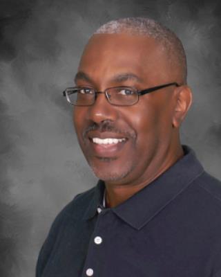 Black man in grey shirt